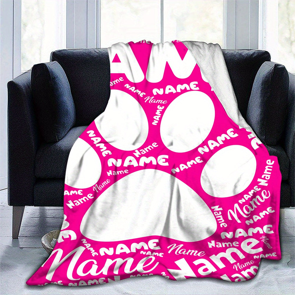 Cozy up with your furry friend's paw print on our custom flannel blanket. Personalize with their name for a warm and special touch. Perfect for snuggling on the couch, bed, or even at the office. Makes a thoughtful gift for any pet owner, family member