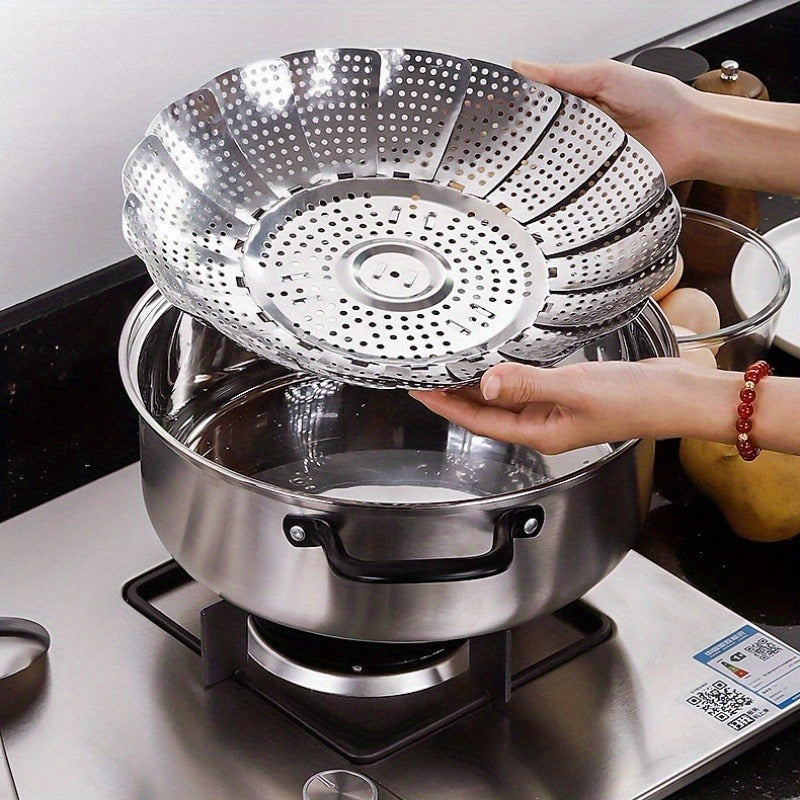 Folding stainless steel steaming tray with multiple functions, retractable design for easy storage, suitable for steaming various foods such as fruits and steamed buns, comes with a lattice steamer rack.