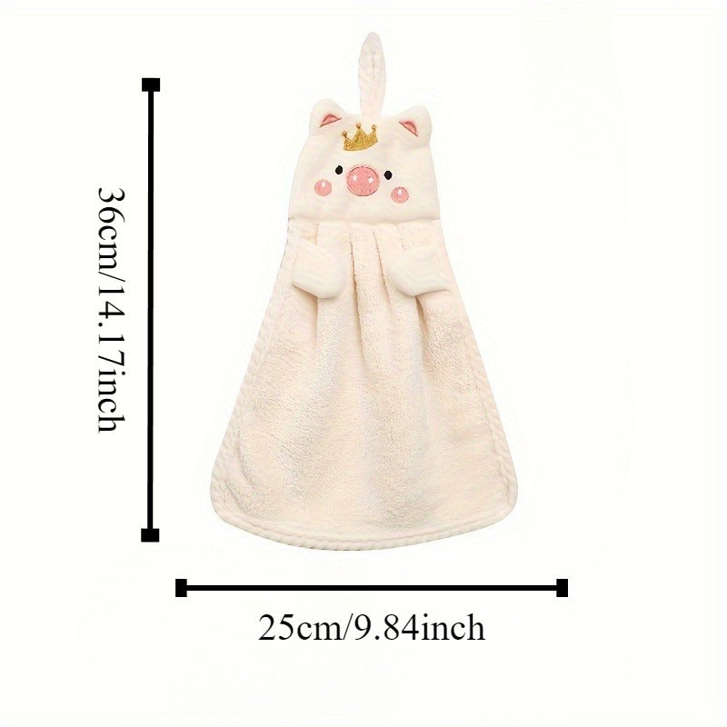 Cute pig-shaped hand towel made of soft coral velvet, quick-drying and absorbent for kitchen and bathroom use. Features hanging loop, gentle on hands, and plush texture. Perfect functional decor item for your bathroom.