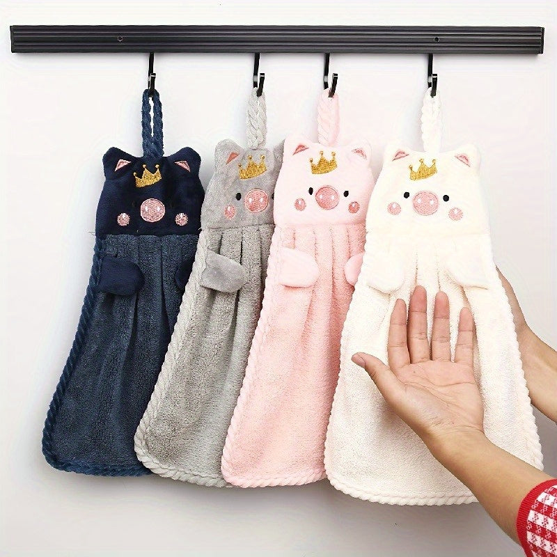 Cute pig-shaped hand towel made of soft coral velvet, quick-drying and absorbent for kitchen and bathroom use. Features hanging loop, gentle on hands, and plush texture. Perfect functional decor item for your bathroom.