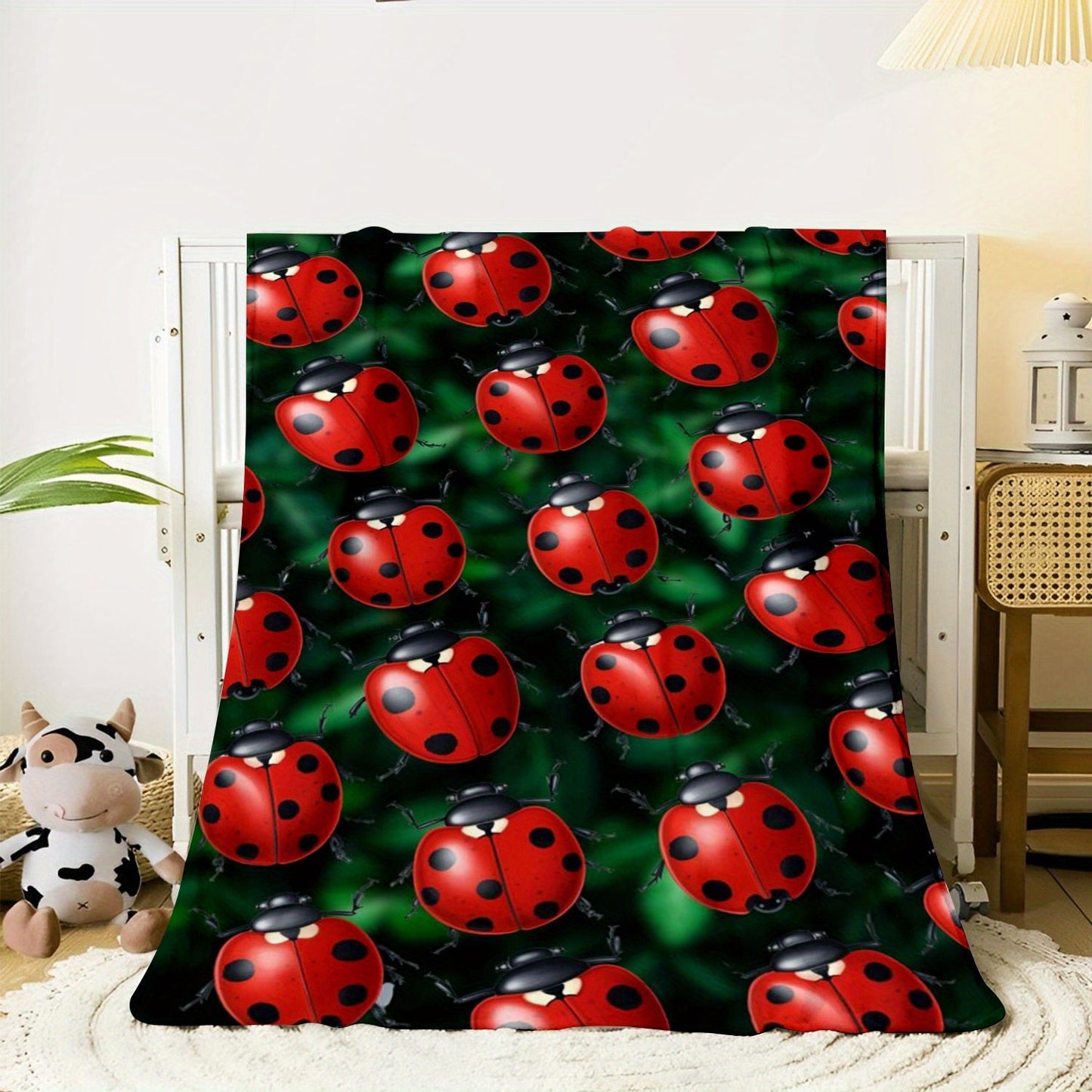 Soft and cozy ladybug print flannel throw blanket perfect for sofa, bed, office, and travel. This lightweight all-season blanket is made of a comfortable polyester knit, featuring a contemporary animal theme with digital printing. With a weight of