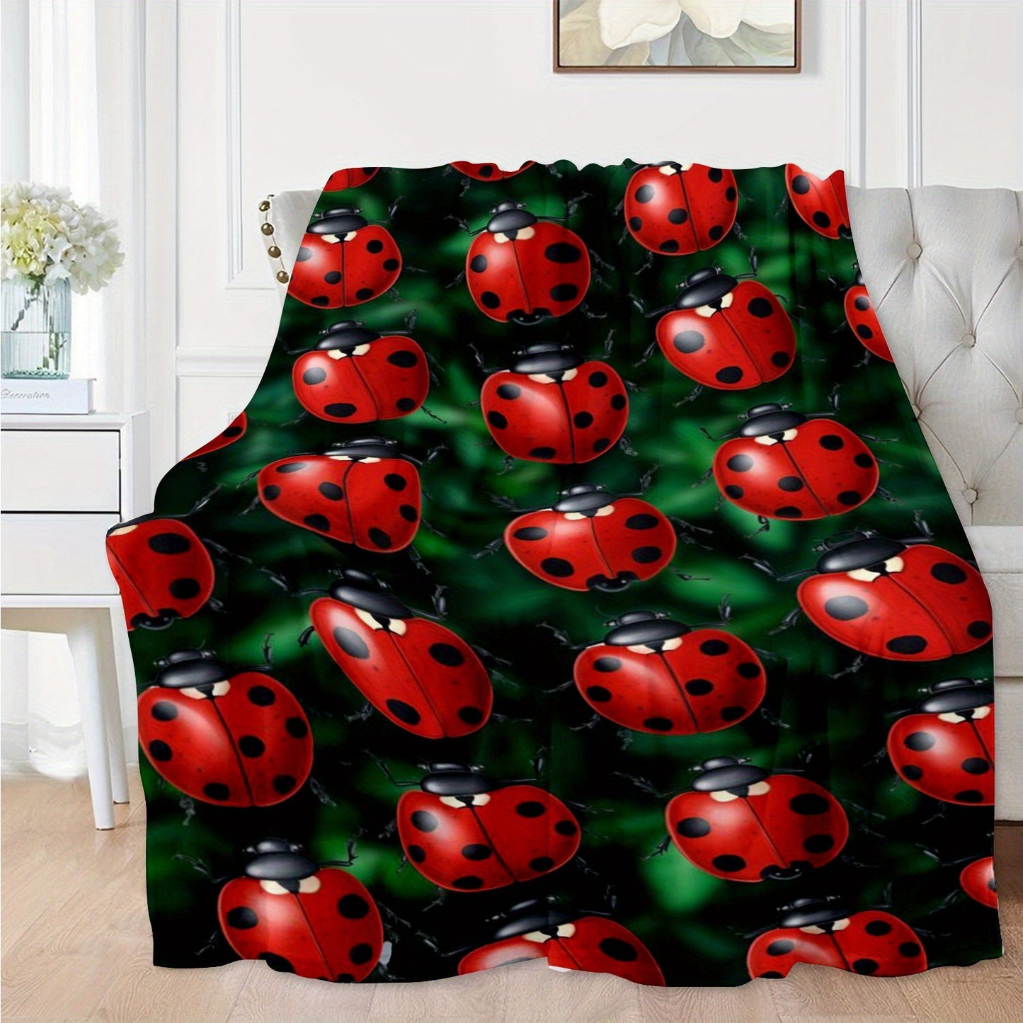 Soft and cozy ladybug print flannel throw blanket perfect for sofa, bed, office, and travel. This lightweight all-season blanket is made of a comfortable polyester knit, featuring a contemporary animal theme with digital printing. With a weight of