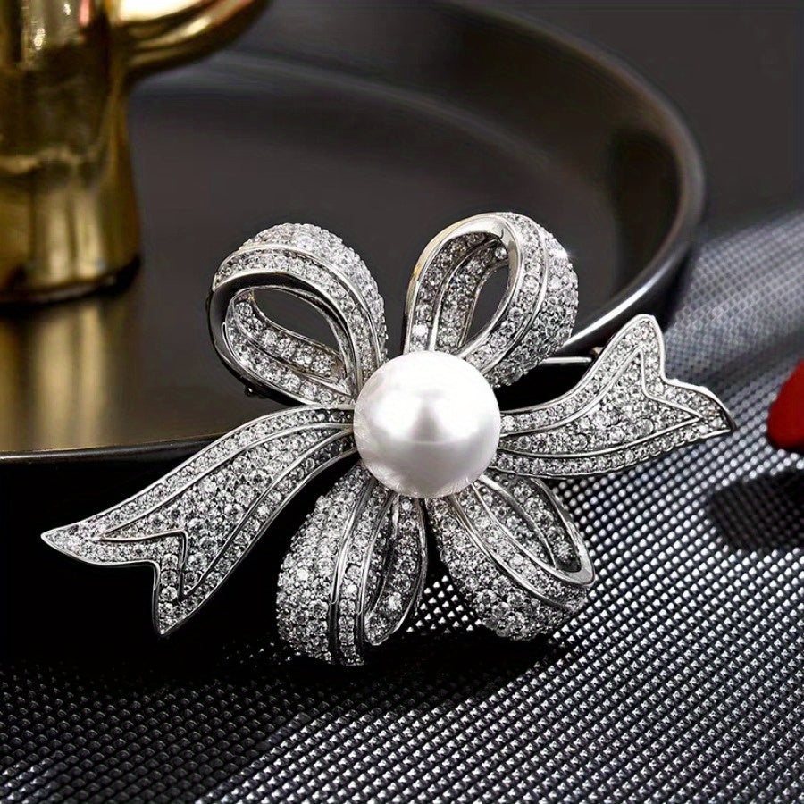 Elegant pearl brooch with a non-specific flower design, perfect for both women and men to wear as a fashion accessory. This silky scarf buckle exudes a luxurious and elegant temperament, making it a great holiday gift for anyone looking to add a touch of