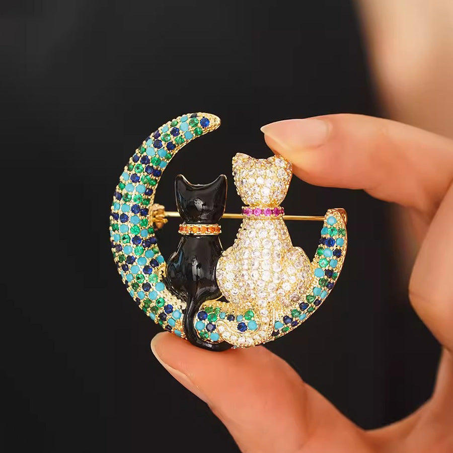 A stunning Crystal Cat Moon Brooch crafted in luxury, adorned with sparkling rhinestones and an elegant design - the perfect exquisite gift for women.