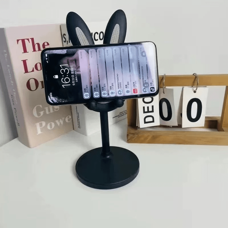 Flexible desktop holder for phones and tablets, made of ABS material, with adjustable height and viewing angle for home and office use.