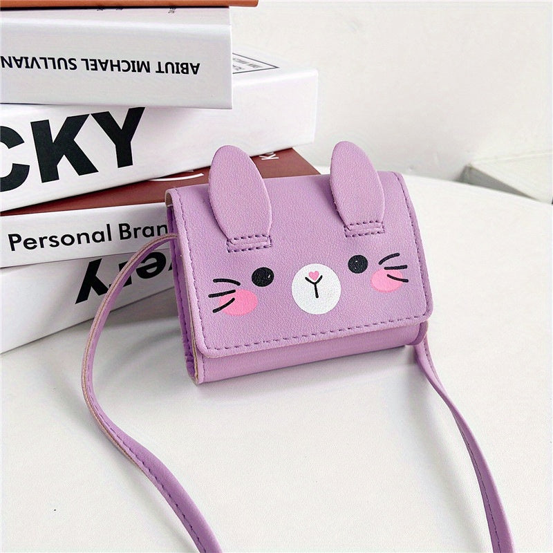 Cute bunny-themed mini crossbody bags in faux leather with adjustable strap. Includes cartoon coin purse and shoulder handbag in various colors. Bunny accessories available.