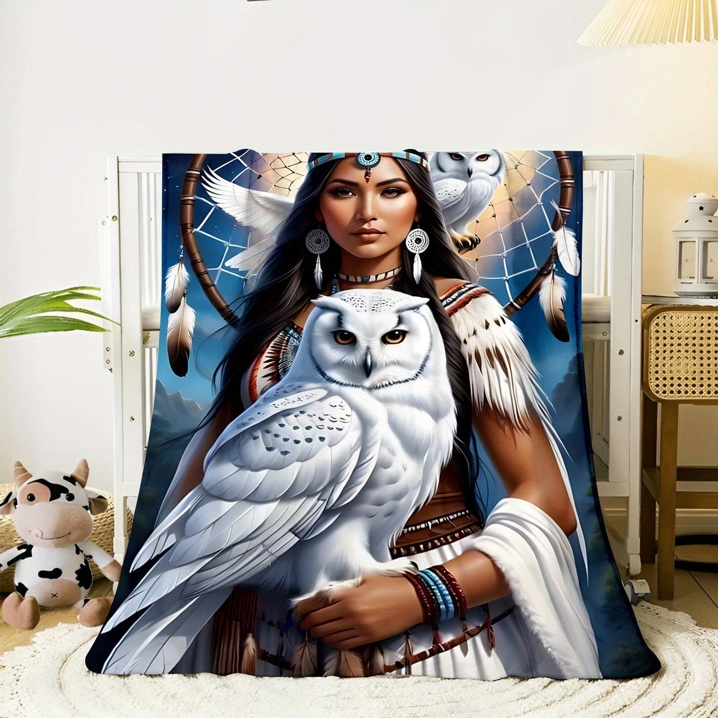 This soft and warm polyester knit flannel throw blanket features a digital print of an eagle queen, perfect for use on the sofa, bed, or while traveling or camping. The contemporary design includes a dreamcatcher and owl, making it suitable for use in