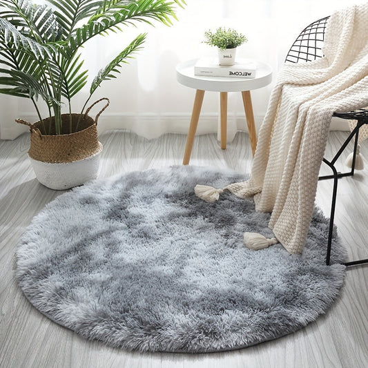 Soft and plush round gray area rug with a shag texture - Resistant to stains and slips, perfect as a fluffy decorative accent for your living room, bedroom, or home interior. Made of polyester and recommended for dry cleaning only. Ideal for adding a