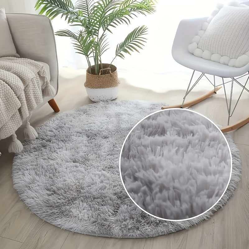 Soft and plush round gray area rug with a shag texture - Resistant to stains and slips, perfect as a fluffy decorative accent for your living room, bedroom, or home interior. Made of polyester and recommended for dry cleaning only. Ideal for adding a