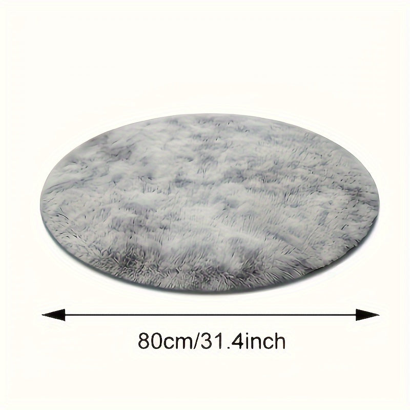 Soft and plush round gray area rug with a shag texture - Resistant to stains and slips, perfect as a fluffy decorative accent for your living room, bedroom, or home interior. Made of polyester and recommended for dry cleaning only. Ideal for adding a