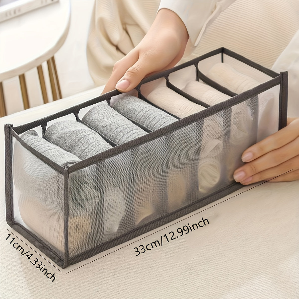 Nylon knit fabric organizer box with dividers for socks, panties, bras. Space-saving folding design for closets and bedrooms. Hand washable or dry cleanable. Multi-piece set.