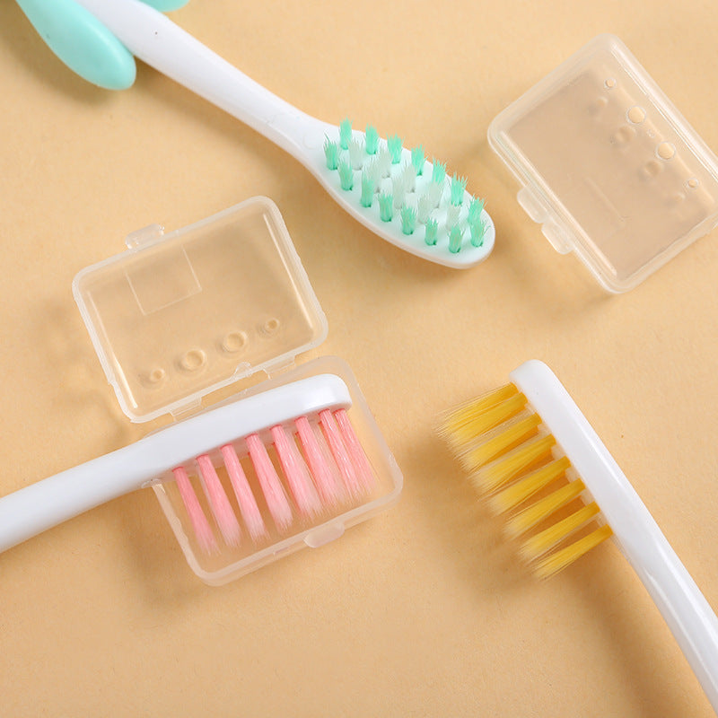 4 soft-bristled toothbrushes with charcoal and cute animal designs for teeth care.