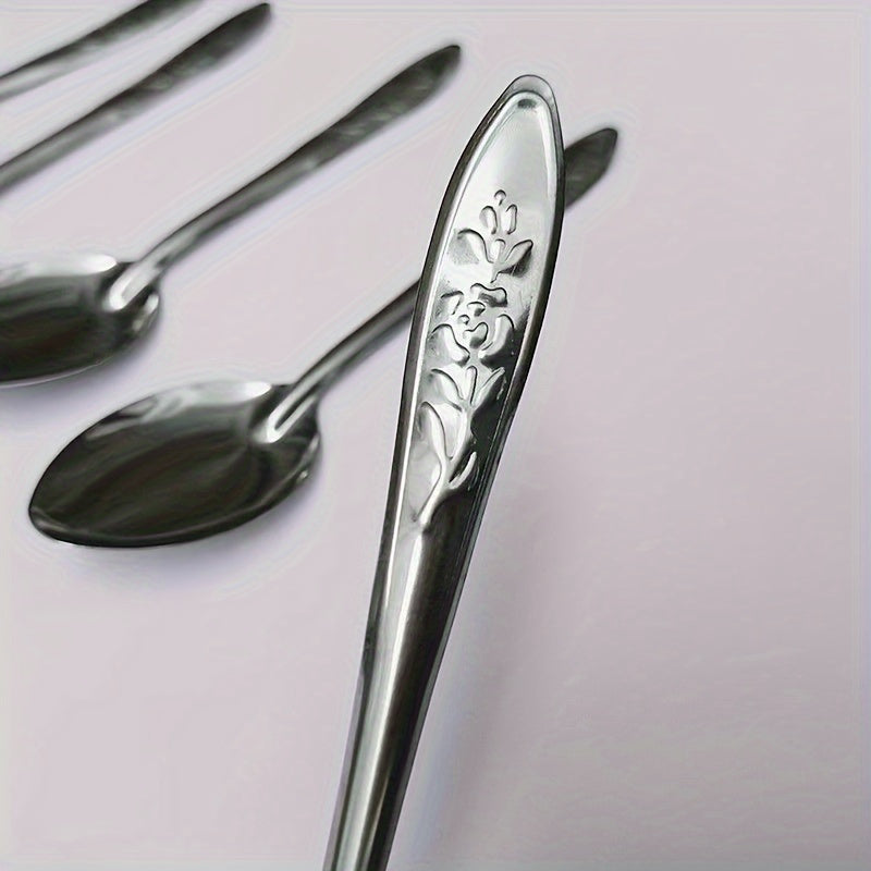 Set of 6 elegant dessert spoons made of stainless steel, featuring beautiful rose engravings. Ideal for use with coffee, fruit, and more. The shiny reflective finish makes them perfect for both home and restaurant use.