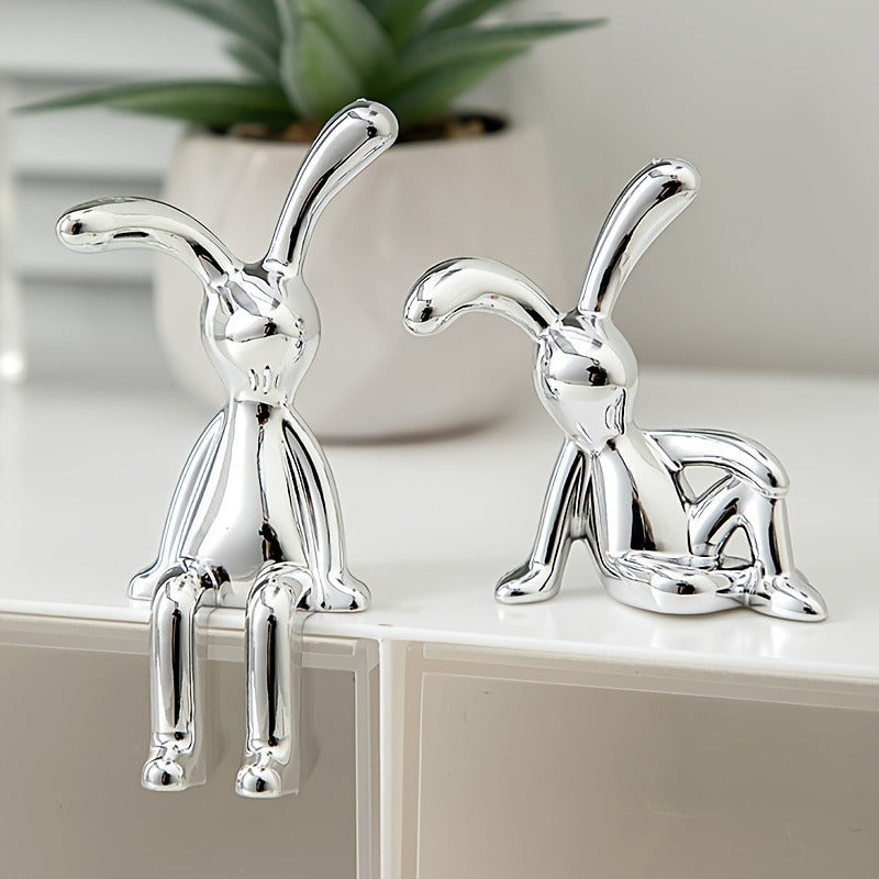 Two silver-plated resin rabbit ornaments perfect for any room, making a great Easter gift.