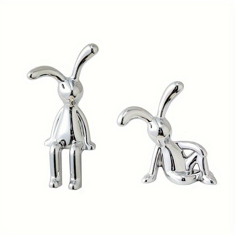 Two silver-plated resin rabbit ornaments perfect for any room, making a great Easter gift.