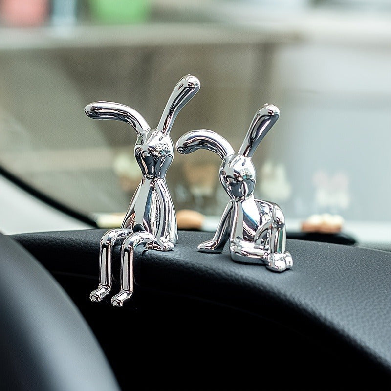 Two silver-plated resin rabbit ornaments perfect for any room, making a great Easter gift.