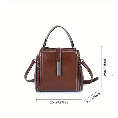 Stylish leather shoulder bag for women with removable strap, zipper closure, and edge paint detail. Available in black, coffee, and light brown.