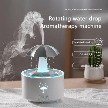 A rotating umbrella humidifier with water droplets and large mist output, desktop aromatherapy machine with colorful lights, remote control included, ideal for bedrooms and offices.