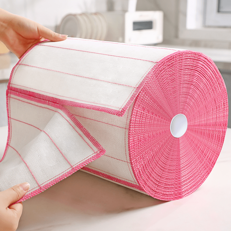 One roll of absorbent microfiber dish cloths, lint-free cotton kitchen cleaning towels, scouring pads, and reusable cleaning rags made from non-woven fabric, perfect for home use.