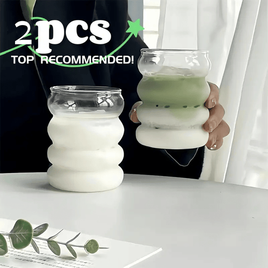 Two stylish thick glass milk and coffee cups, perfect for home use. These cups are reusable and durable, making them a great addition to your kitchen.