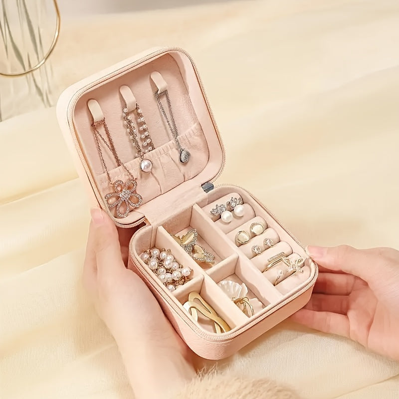 Waterproof PU jewelry organizer with zipper and detachable dividers. Ideal for rings, necklaces, watches, and earrings. Perfect gift for Christmas or Halloween. Great for travel and storage.