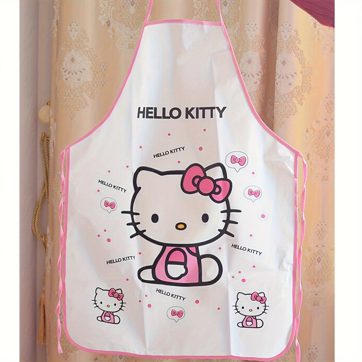 Hello Kitty Baby Bib Set made from durable linen blend with officially licensed design. Includes matching sleeves and woven polyethylene cover with acrylic lining. Suitable for cooking and