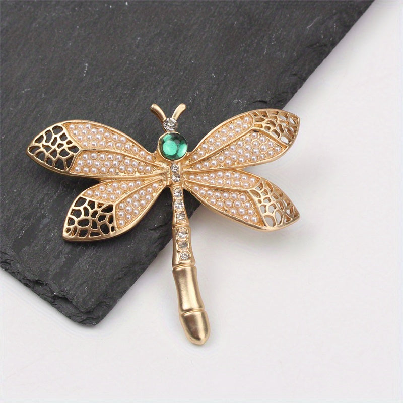 Add a touch of vintage charm with this exquisite Golden Dragonfly Brooch, crafted from luxurious alloy and enamel. Perfect for embellishing dresses, sweaters, and suits with a retro flair. This elegant accessory features a stunning golden dragonfly