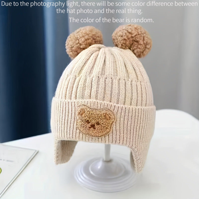 Soft polyester knit hat with cozy bear theme and ear warmers for young children, perfect winter gift for boys and girls aged 0-3 years. Comes in khaki, coffee, and ivory colors.