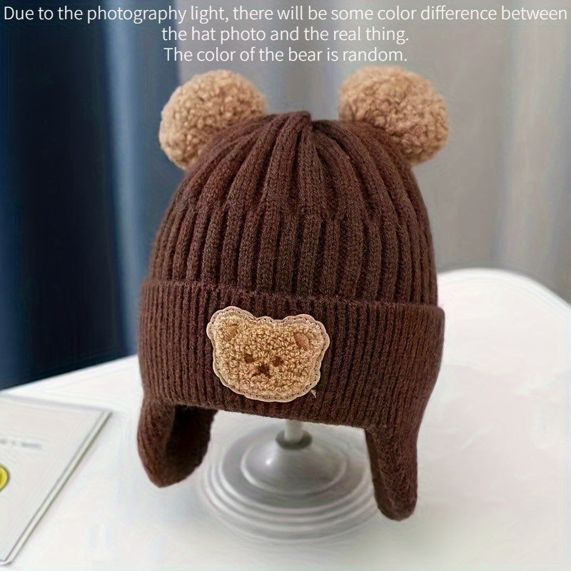 Soft polyester knit hat with cozy bear theme and ear warmers for young children, perfect winter gift for boys and girls aged 0-3 years. Comes in khaki, coffee, and ivory colors.