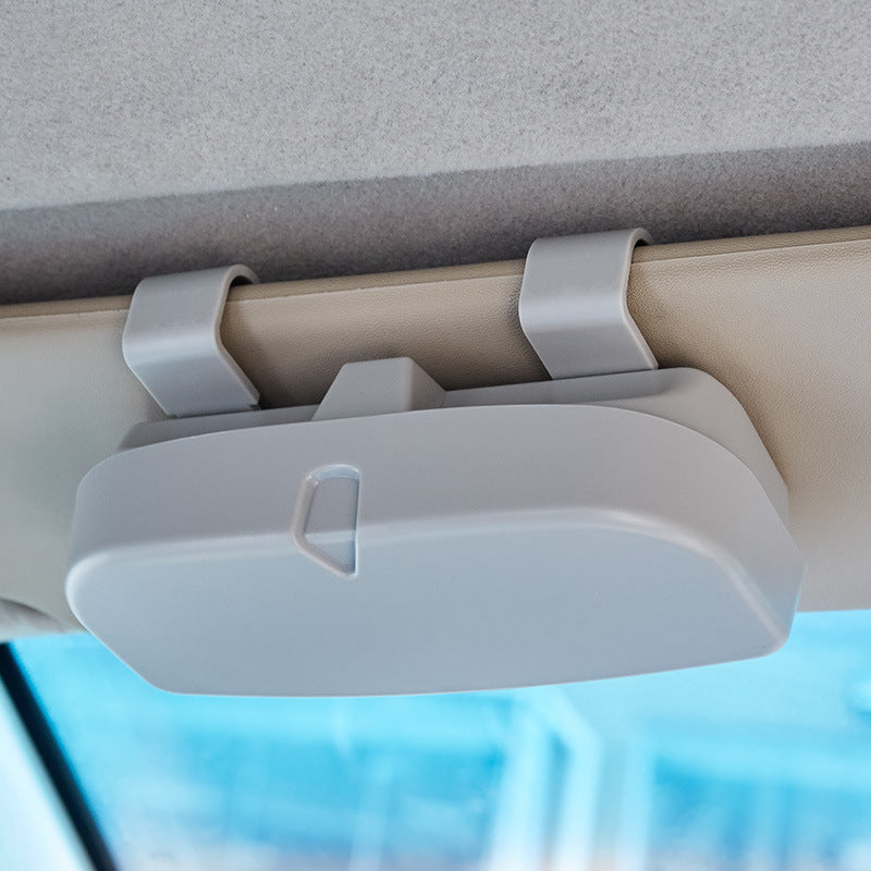 Universal Car Sun Visor Glasses Holder made of durable ABS resin with buckle mount, multifunctional interior accessory.