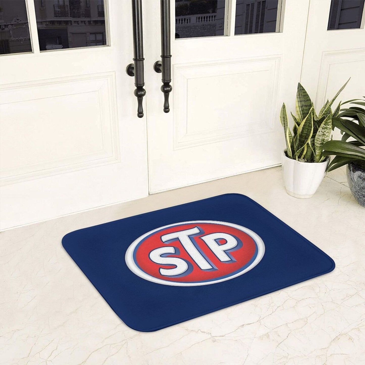 STP Logo Doormat - This lightweight, machine washable, non-slip polyester welcome mat is perfect for use in the kitchen, bedroom, or entryway. This rectangle-shaped, machine-made rug is a stylish and practical addition to any home.