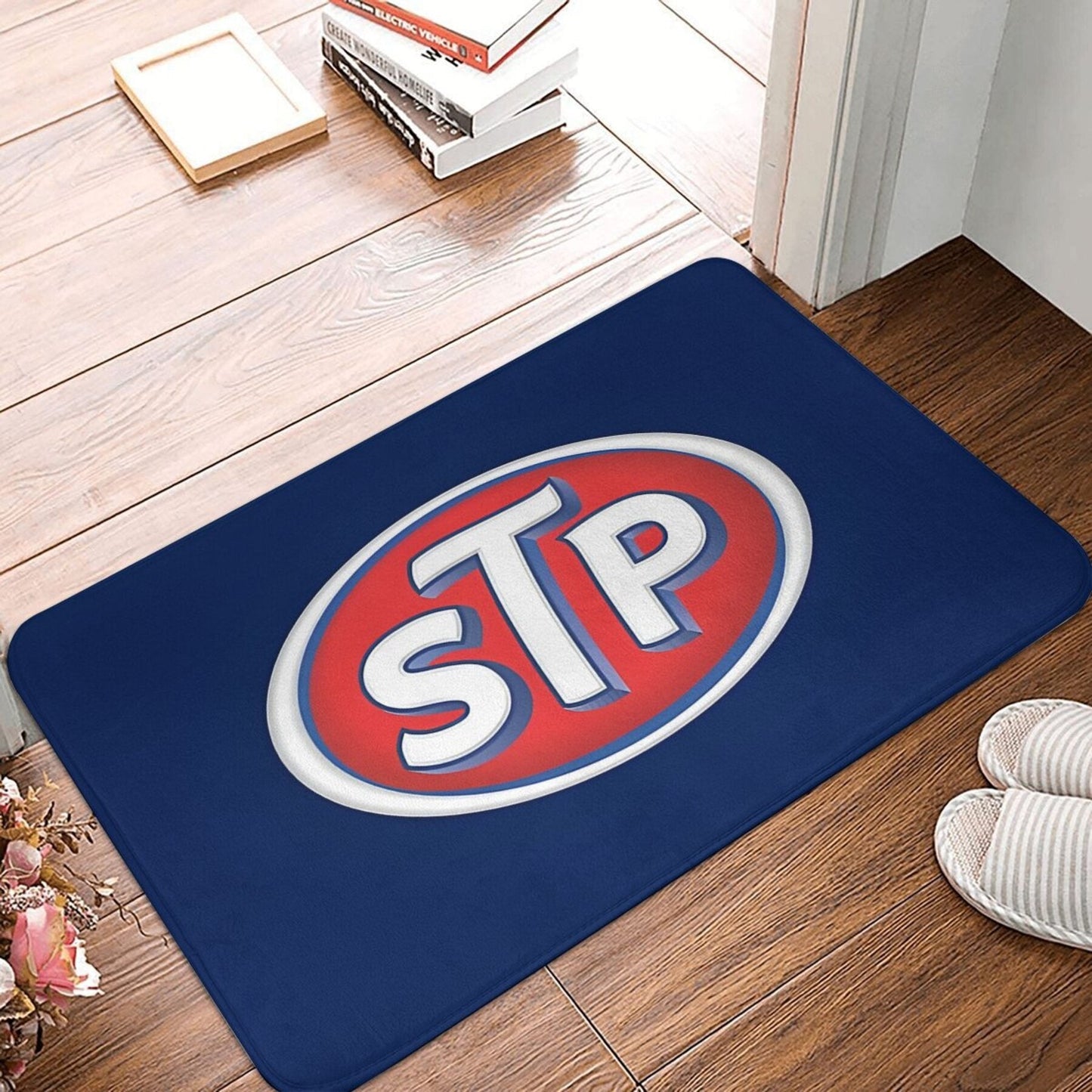 STP Logo Doormat - This lightweight, machine washable, non-slip polyester welcome mat is perfect for use in the kitchen, bedroom, or entryway. This rectangle-shaped, machine-made rug is a stylish and practical addition to any home.