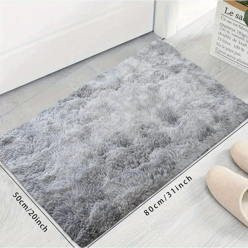 Soft and cozy gray tie-dye plush rug for living room and bedroom decor, providing fluffy shaggy comfort. Non-slip and stain resistant, ideal for home decoration.