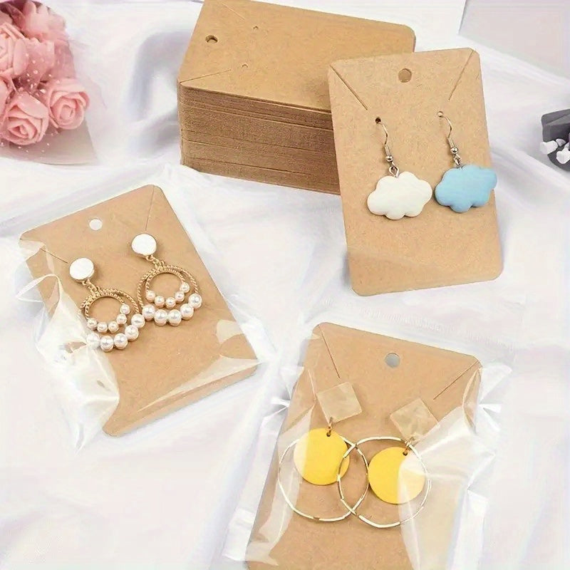 100 DIY handmade jewelry packaging bags for small accessories, keychains, earrings, headbands, and pendants. Includes necklace display stand card and self-adhesive packaging cards. Ideal