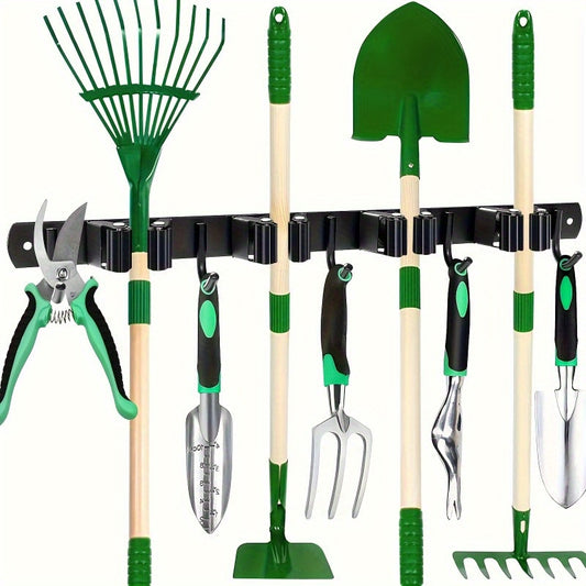 Heavy-duty metal tool organizer rack with 4 slots and 5 hooks in green and black color. Suitable for wall-mounted storage of garden tools, brooms, mops, and garage equipment.