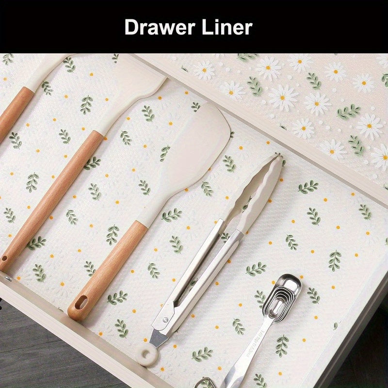 Modern floral pattern EVA shelf liner in daisy print. This non-adhesive, non-slip drawer mat is made of durable rubber and is perfect for protecting cabinets in the kitchen, refrigerator, or desk storage.