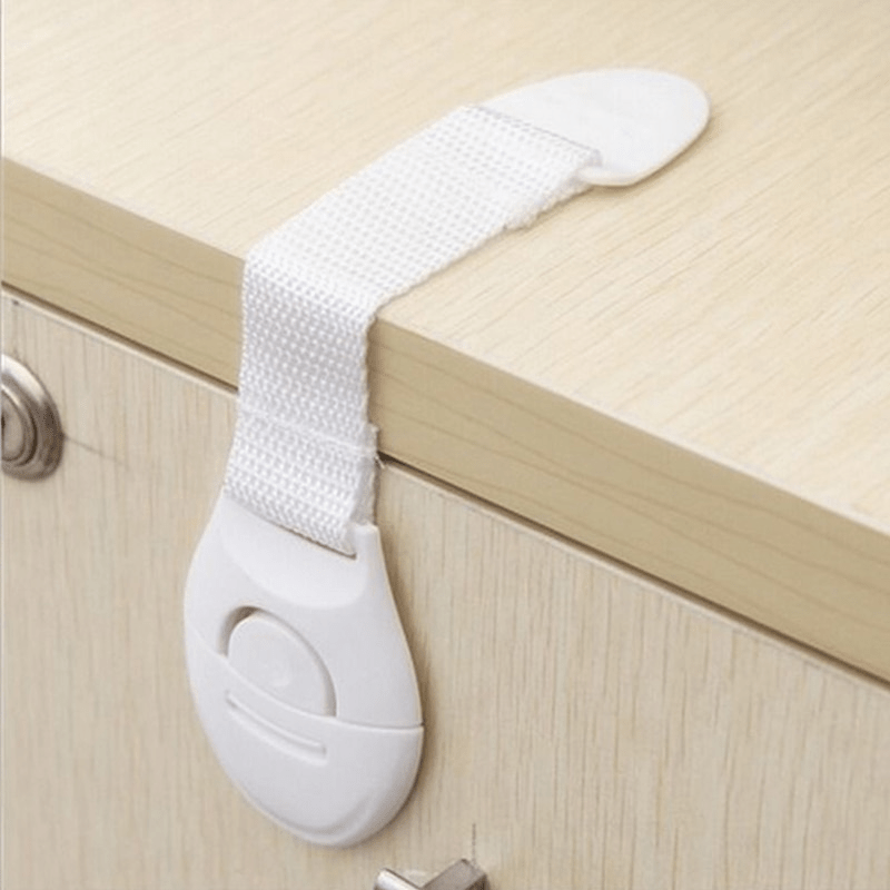 A set of 10 white plastic safety cabinet locks with adjustable childproofing straps, easy installation, tamper-resistant design, lead-free materials, suitable for securing drawers and doors for home security.