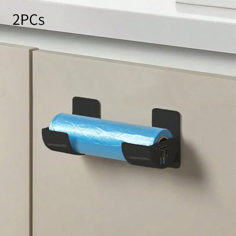 Wall-mounted storage organizer that saves space and holds plastic wrap and garbage bags without the need for drilling. Made of durable plastic, it is perfect for storing items on the side of the refrigerator.