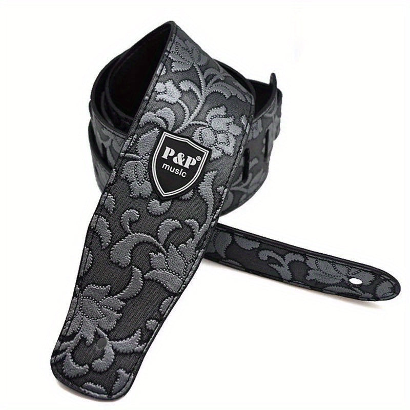 Wide 6.35 cm faux leather electric guitar strap with adjustable soft embroidering in various colors.