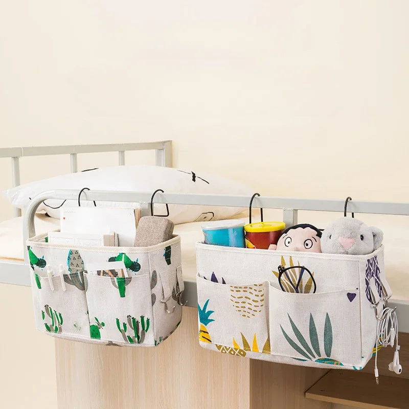 Portable hanging crib organizer for essential care items and bed accessories.