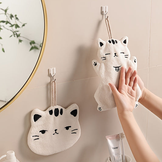 Cute cat-shaped hand towel made of soft coral fleece material with quick-dry feature, suitable for use in bathroom and kitchen with its hanging design.