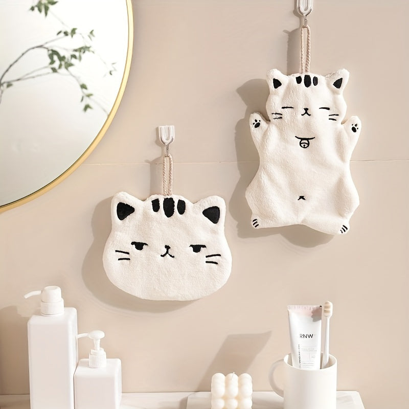 Cute cat-shaped hand towel made of soft coral fleece material with quick-dry feature, suitable for use in bathroom and kitchen with its hanging design.