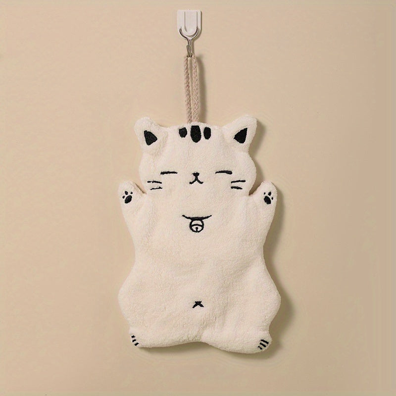 Cute cat-shaped hand towel made of soft coral fleece material with quick-dry feature, suitable for use in bathroom and kitchen with its hanging design.