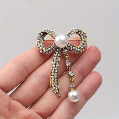 Luxurious Vintage-Inspired Bow Brooch Pin with Rhinestones and Pearl Dangle - Elegant Alloy Bowtie Lapel Pin for Women's Fashion Statement