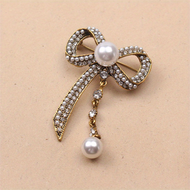 Luxurious Vintage-Inspired Bow Brooch Pin with Rhinestones and Pearl Dangle - Elegant Alloy Bowtie Lapel Pin for Women's Fashion Statement