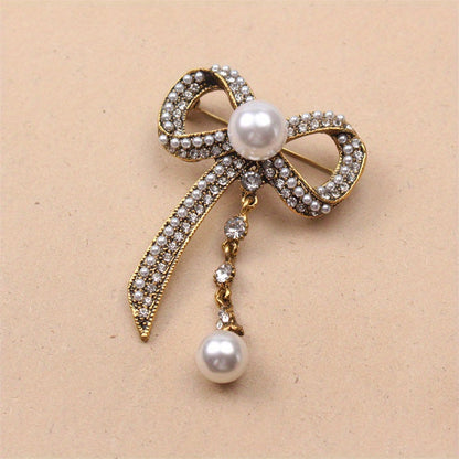 Luxurious Vintage-Inspired Bow Brooch Pin with Rhinestones and Pearl Dangle - Elegant Alloy Bowtie Lapel Pin for Women's Fashion Statement