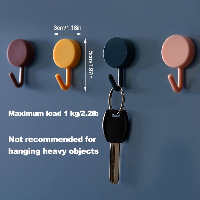 10 self-adhesive hooks for various uses, such as keys, coats, towels, and home decor. Perfect for bathroom, bedroom, and entrance doors.