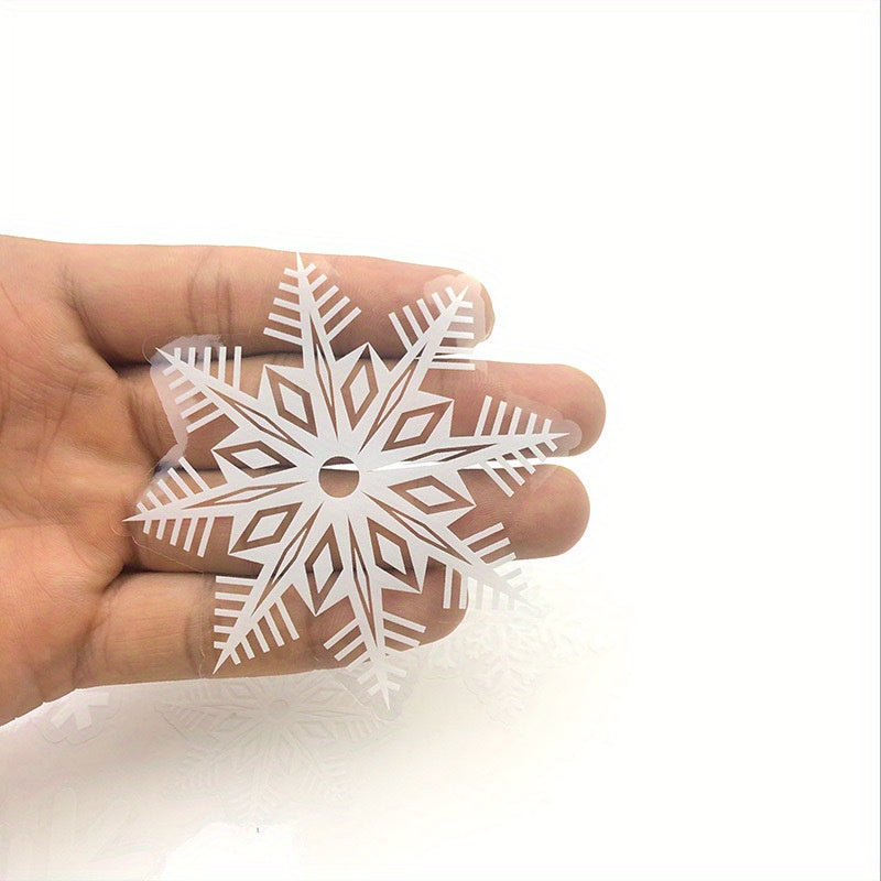 These Christmas Window Decals include 80 removable static cling snowflake stickers in white, perfect for holiday glass decor. They require no electricity or feathers to adhere.