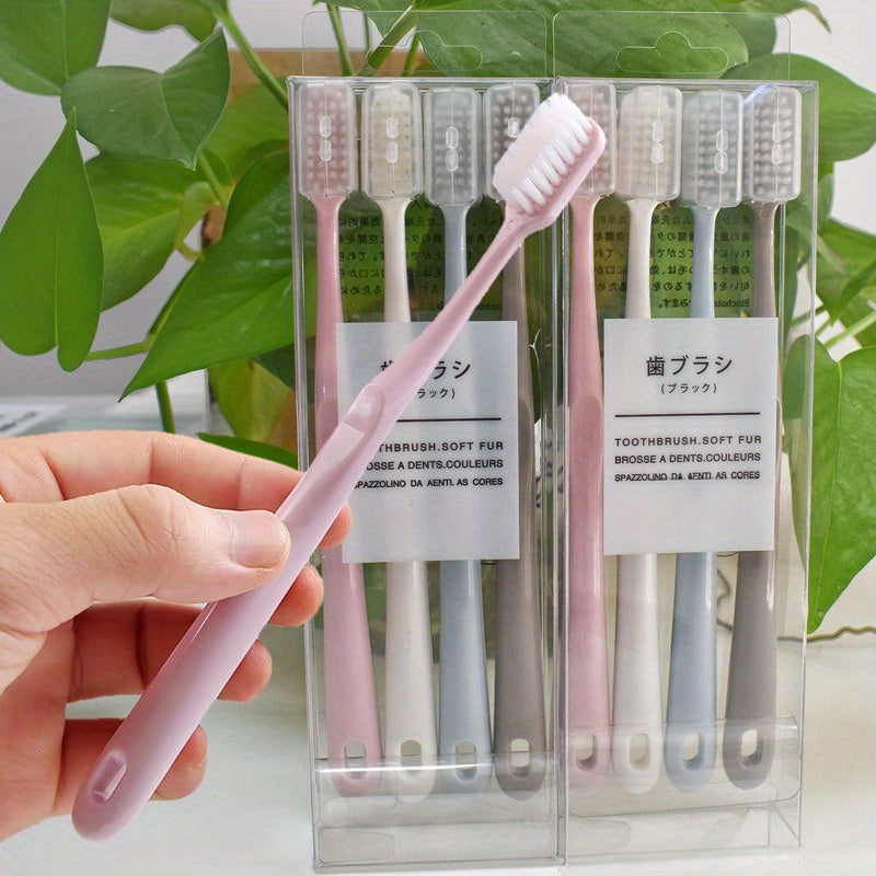 4 Japanese macaron-colored toothbrushes with soft bristles and protective covers for portable and professional dental care for adults.