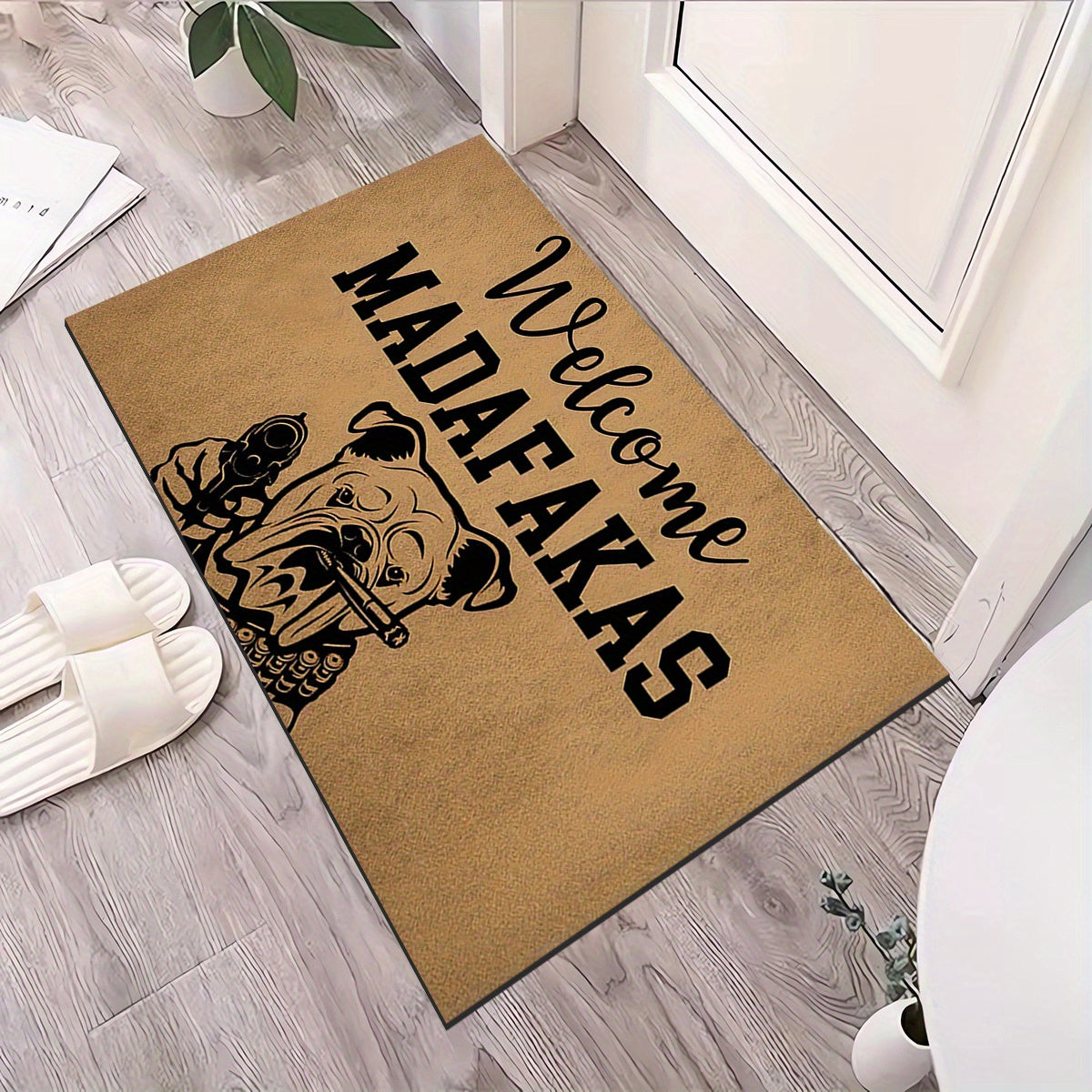 A unique welcome mat featuring a "Welcome Madafakas" design, complete with a dog holding a gun pattern. This anti-slip, absorbent mat is easy to clean and made of crystal velvet carpet material. Perfect for use in entrances, bedrooms, farms, and both